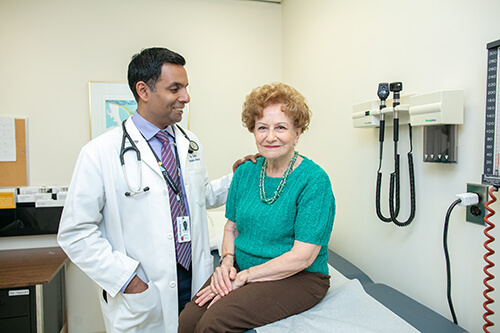 image of Dr. Samir Sinha with patient